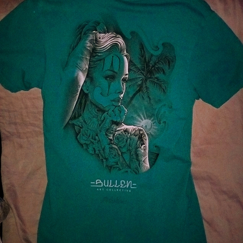 Teal 'Sullen Art Co.' portrait of a gorgeous female with almost a clown theme